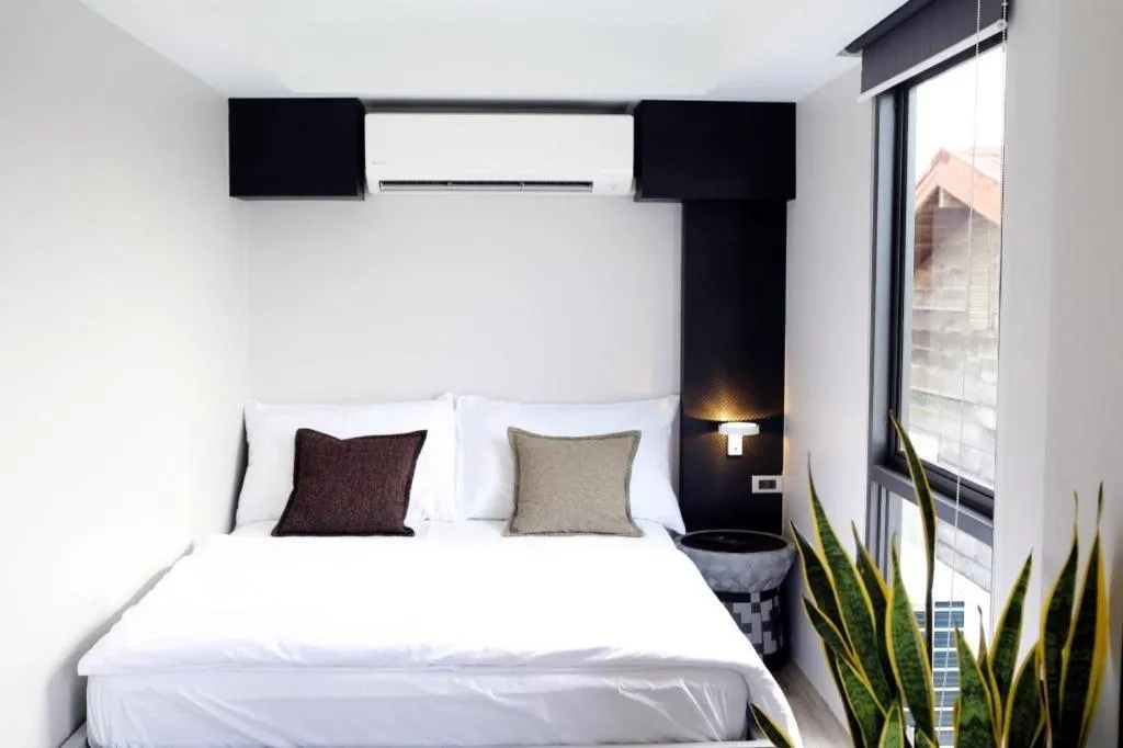 Bed in The River House Chiangkhan Hotel