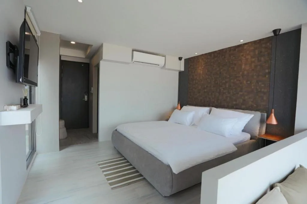 Bed in The River House Chiangkhan Hotel