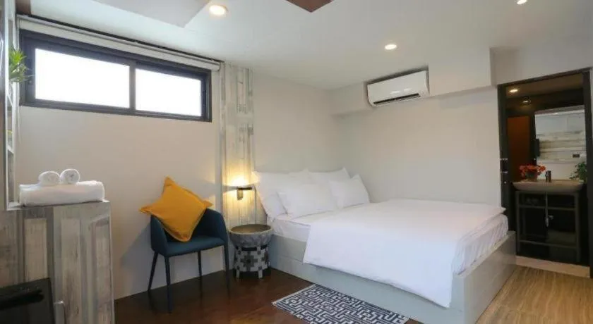 Bed in The River House Chiangkhan Hotel