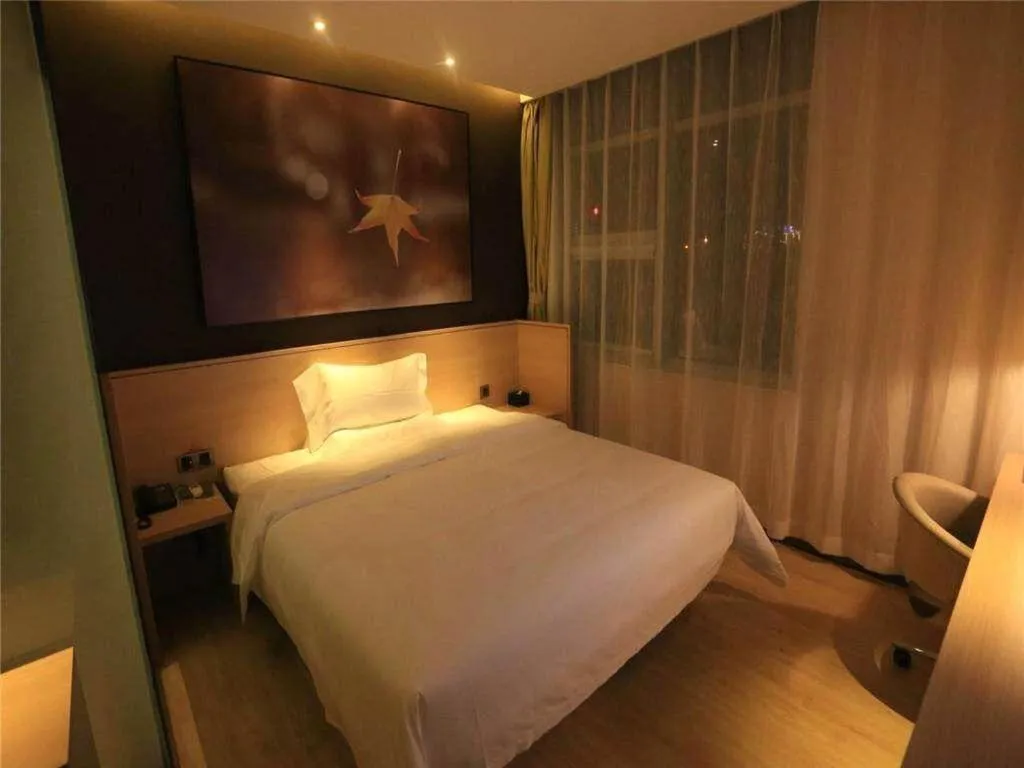 Bed in IU Hotels Xinzhou Bus Terminal