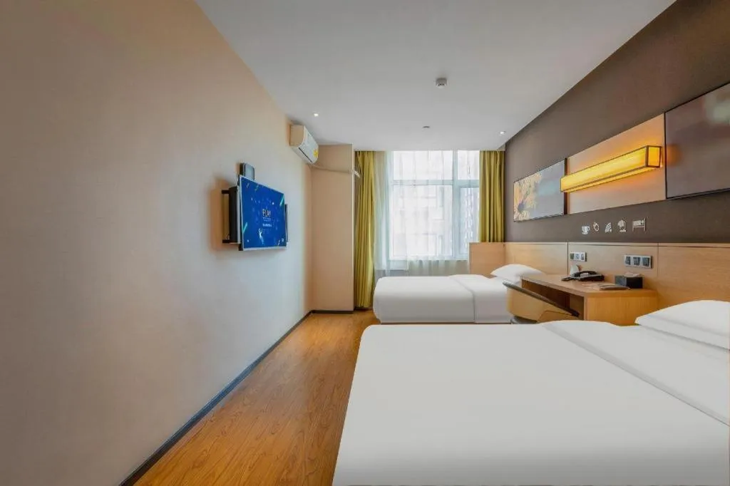 Bed in IU Hotels Xinzhou Bus Terminal