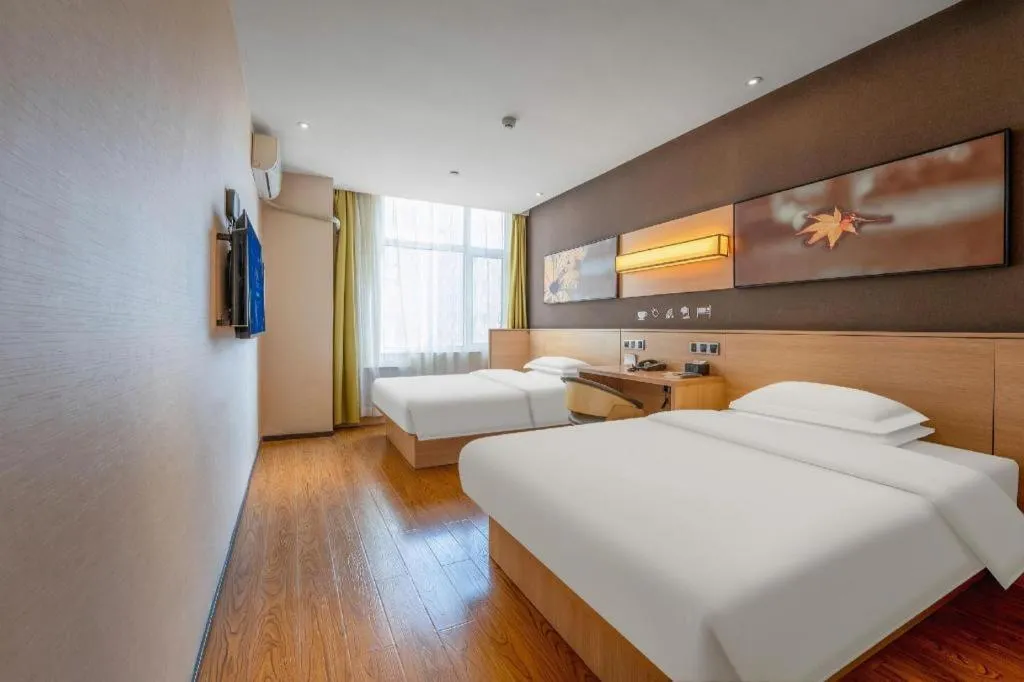 Bed in IU Hotels Xinzhou Bus Terminal