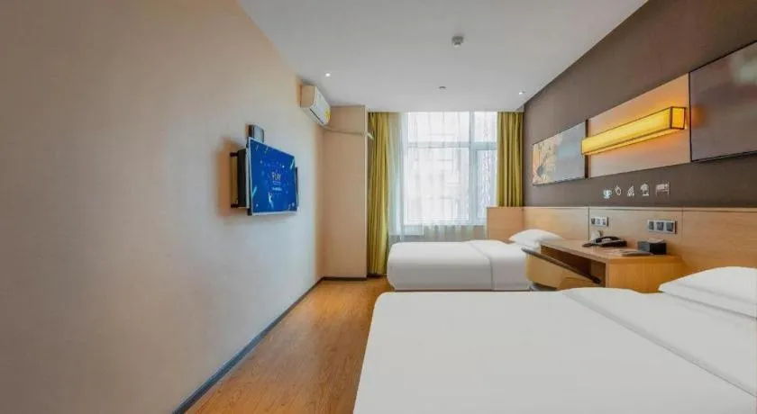 Bed in IU Hotels Xinzhou Bus Terminal