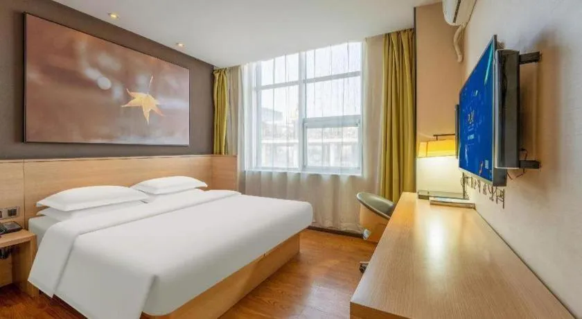 Bed in IU Hotels Xinzhou Bus Terminal