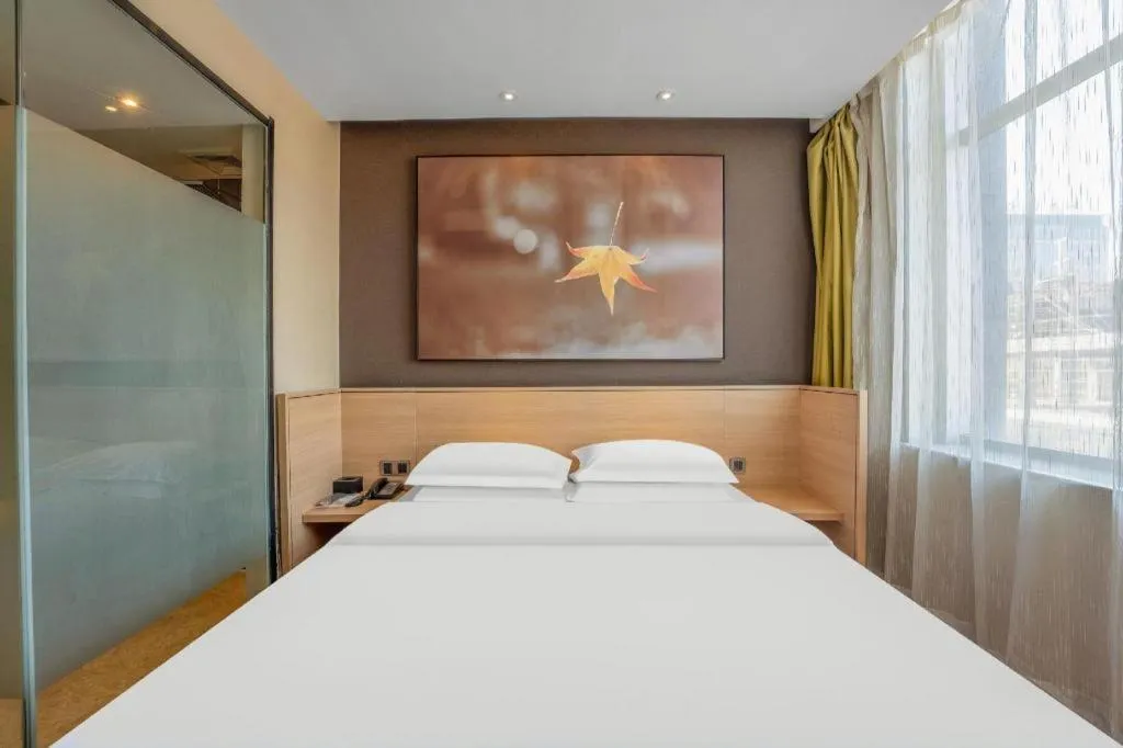 Bed in IU Hotels Xinzhou Bus Terminal