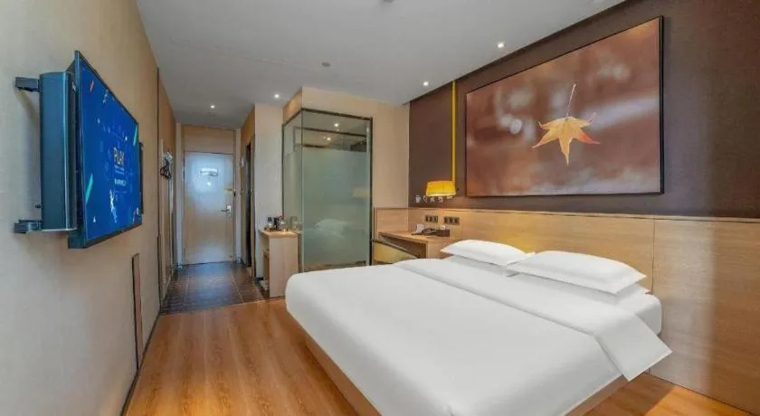 Bed in IU Hotels Xinzhou Bus Terminal