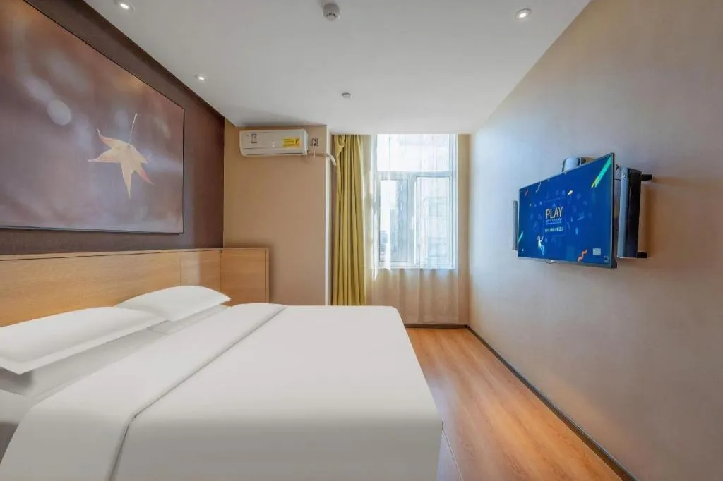 Bed in IU Hotels Xinzhou Bus Terminal