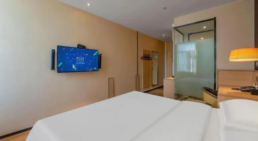 Bed in IU Hotels Xinzhou Bus Terminal