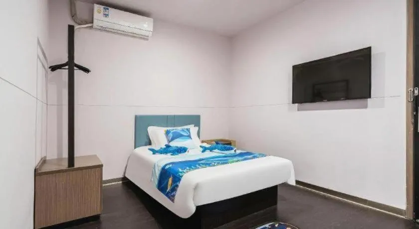 Bed in Magnotel Hotel Shanghai Railway Station Magnolia Plaza