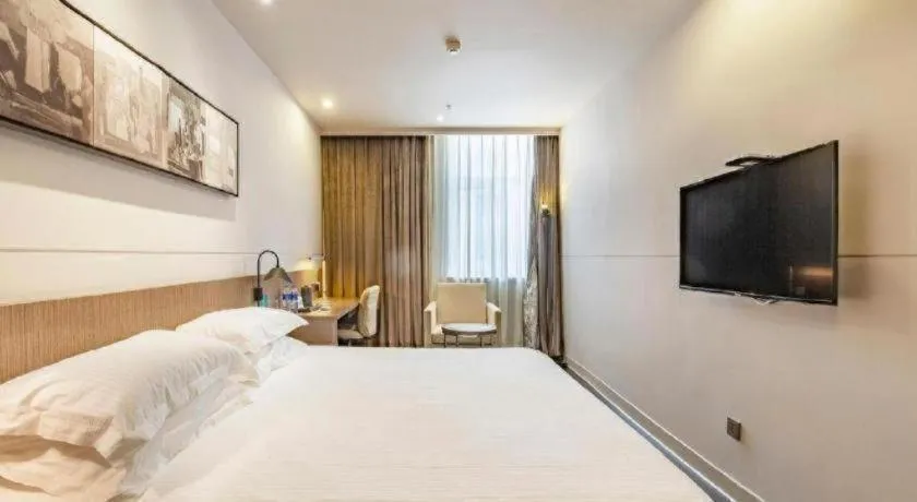 Bed in Jinjiang Inn Select Hohhot Chengjisihan Square Metro Station