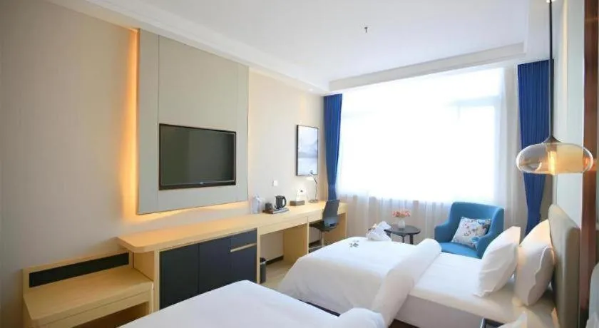 Bed in Jinjiang Metropolo Fuxin Yingbin Street Railway Station