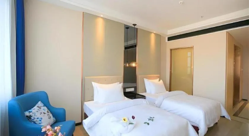 Bed in Jinjiang Metropolo Fuxin Yingbin Street Railway Station