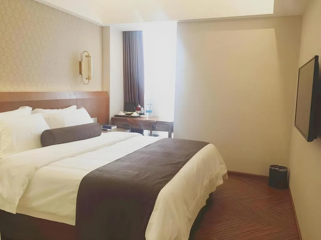 Bed in James Joyce Coffetel Chengdu Century City Convention and Exhibition Center