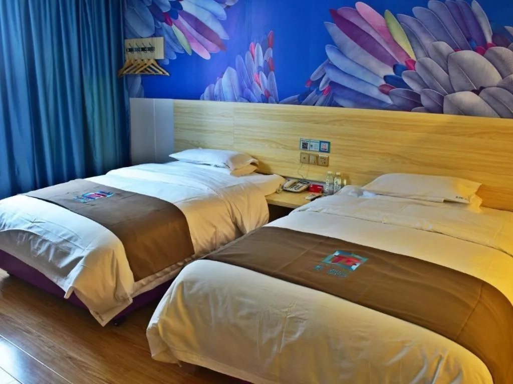 Bed in Hotel Pai Hezhou Lingfeng Plaza