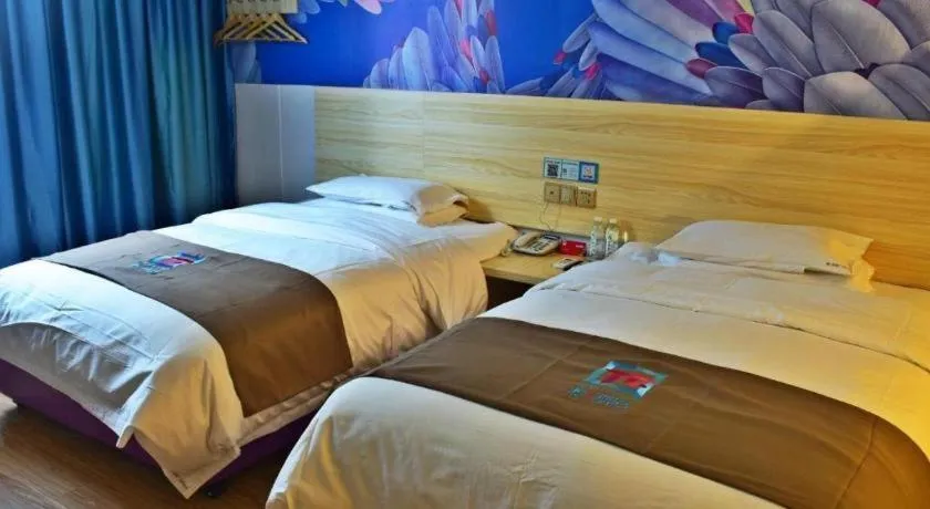 Bed in Hotel Pai Hezhou Lingfeng Plaza