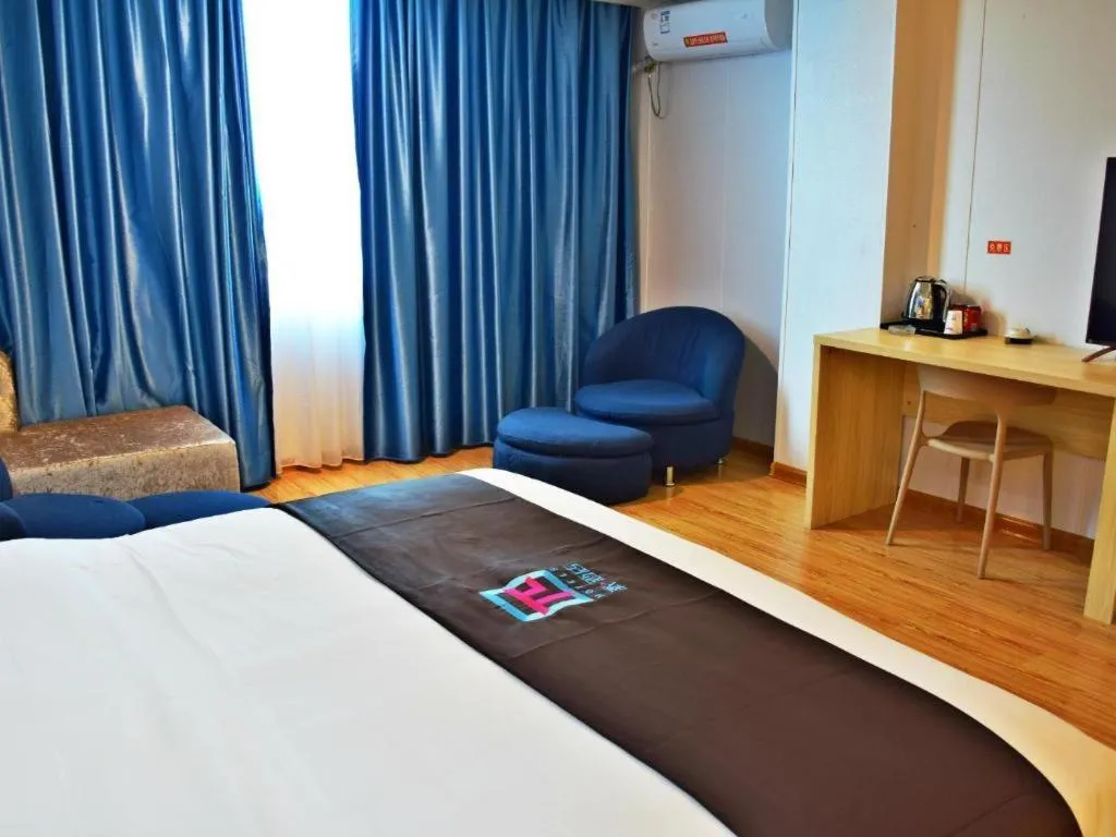 Bed in Hotel Pai Hezhou Lingfeng Plaza