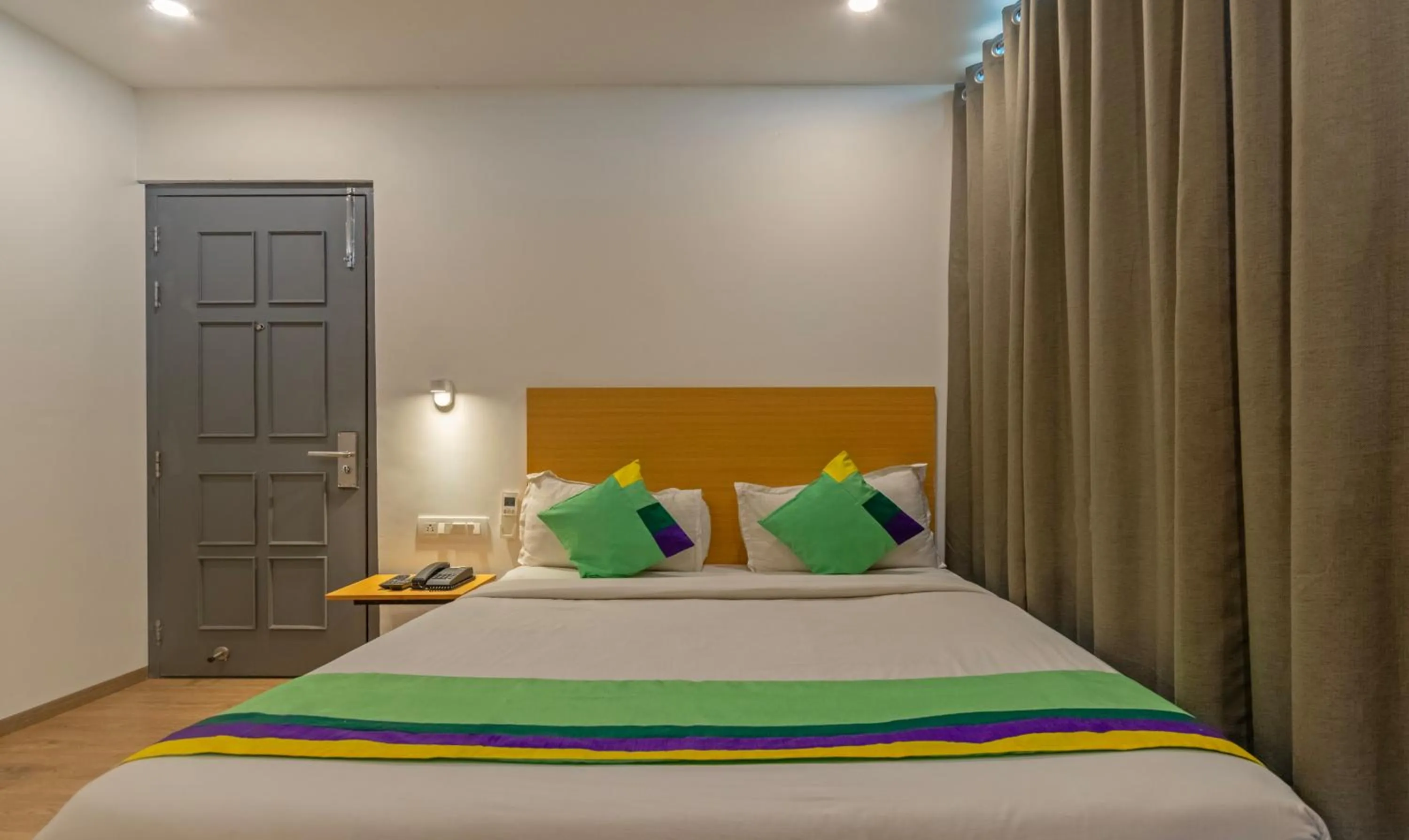 Bedroom, Bed in Treebo The Square