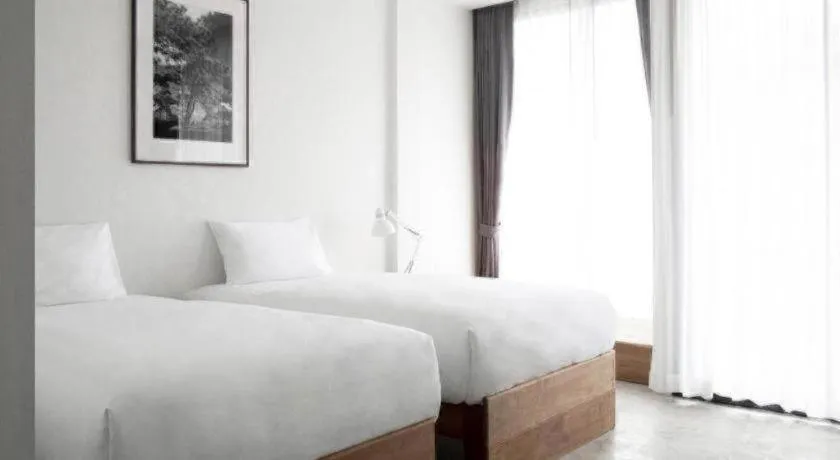 Bed in Rangsiya Boutique Hotel