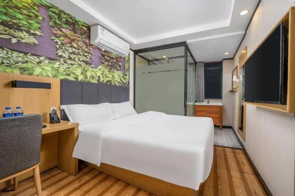 Bed in Yimi Hotel Guangzhou Sport College Branch