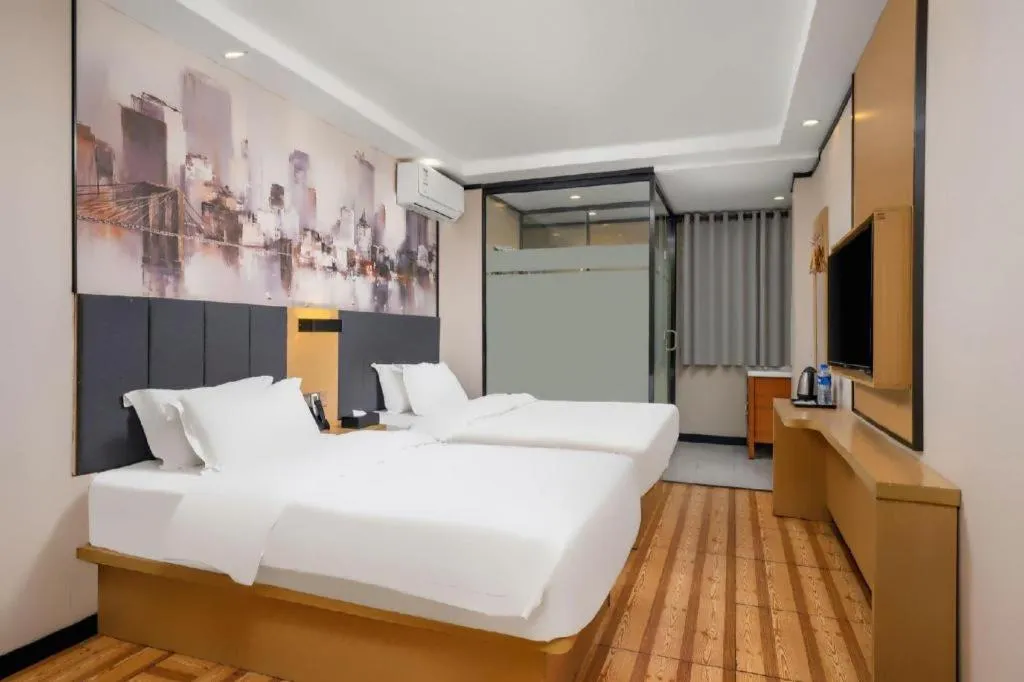 Bed in Yimi Hotel Guangzhou Sport College Branch