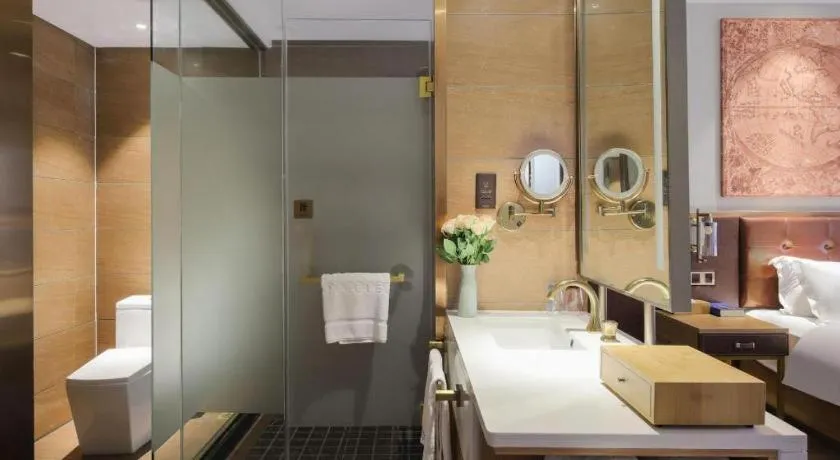 Bed in James Joyce Coffetel Zhengzhou CBD Exhibition Center Provincial People's Hospital