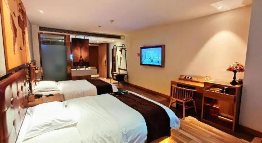 Bed in James Joyce Coffetel Zhengzhou CBD Exhibition Center Provincial People's Hospital