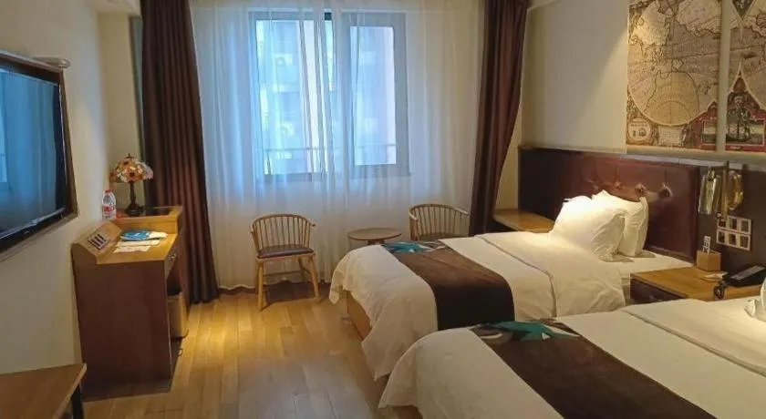 Bed in James Joyce Coffetel Zhengzhou CBD Exhibition Center Provincial People's Hospital