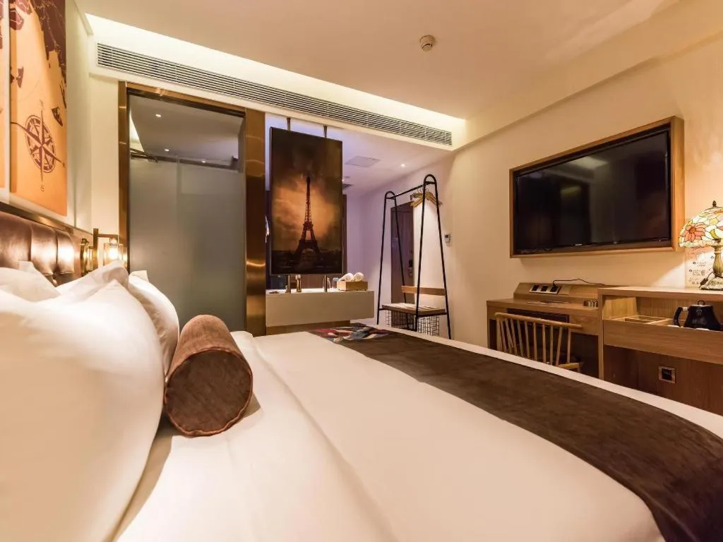 Bed in James Joyce Coffetel Zhengzhou CBD Exhibition Center Provincial People's Hospital