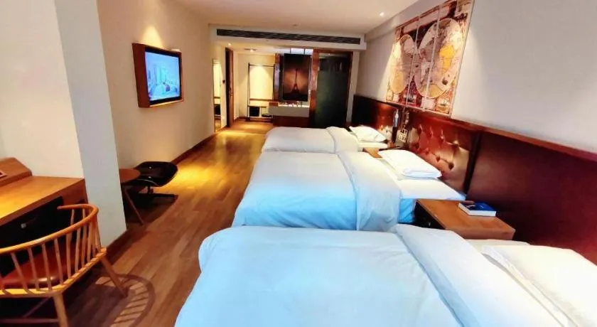 Bed in James Joyce Coffetel Zhengzhou CBD Exhibition Center Provincial People's Hospital