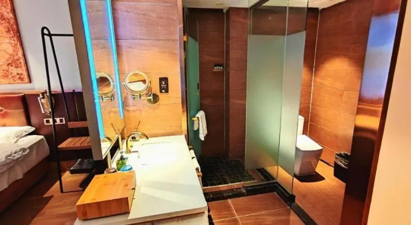 Bed in James Joyce Coffetel Zhengzhou CBD Exhibition Center Provincial People's Hospital