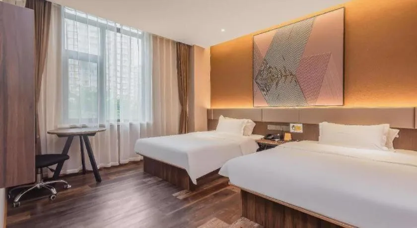 Bed in IU Hotel Qingdao Golden Beach Xuejiadao Metro Station