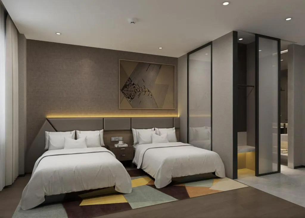 Bed in IU Hotel Qingdao Golden Beach Xuejiadao Metro Station