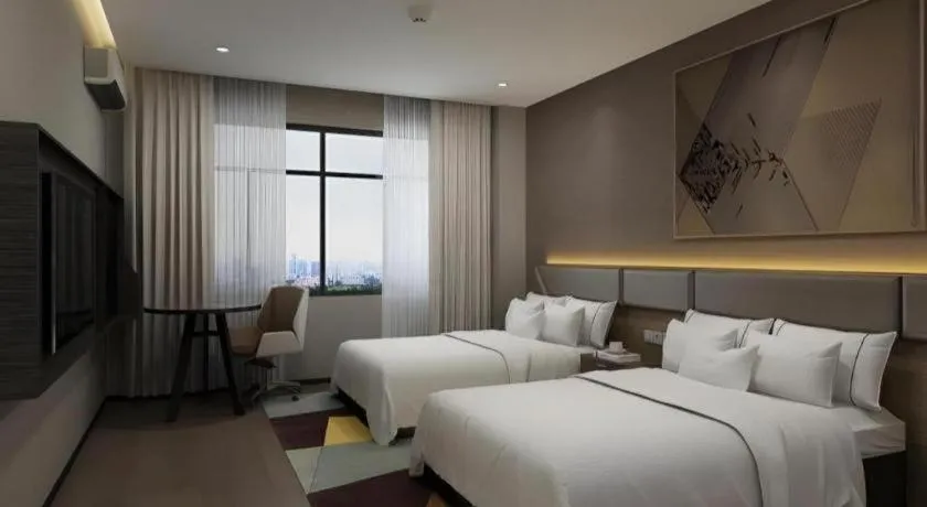 Bed in IU Hotel Qingdao Golden Beach Xuejiadao Metro Station