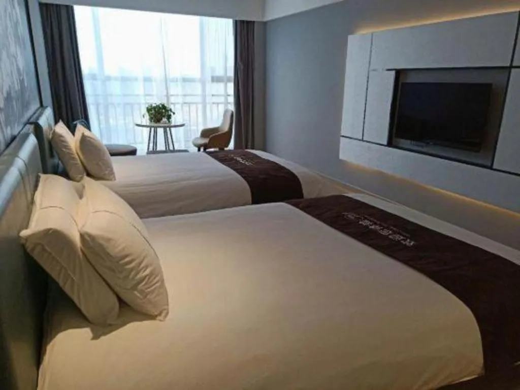 Bed in Magnotel Hotel Anshun West High-Speed Railway Station
