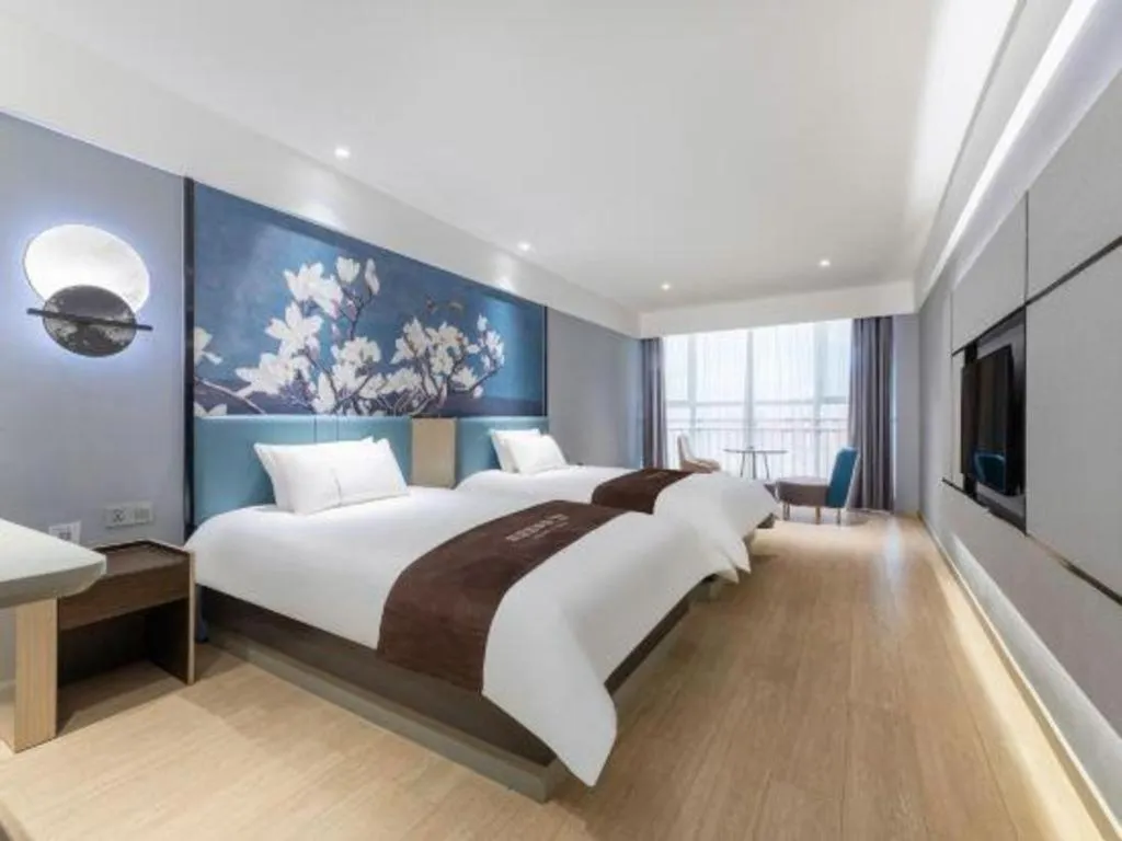 Bed in Magnotel Hotel Anshun West High-Speed Railway Station