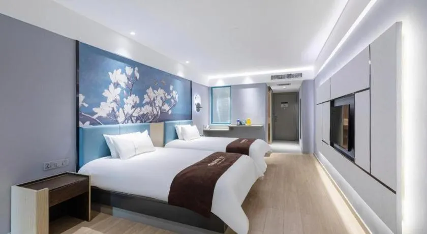 Bed in Magnotel Hotel Anshun West High-Speed Railway Station