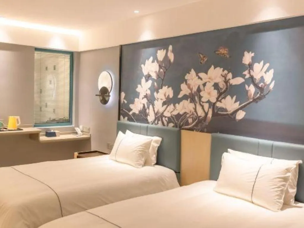 Bed in Magnotel Hotel Anshun West High-Speed Railway Station