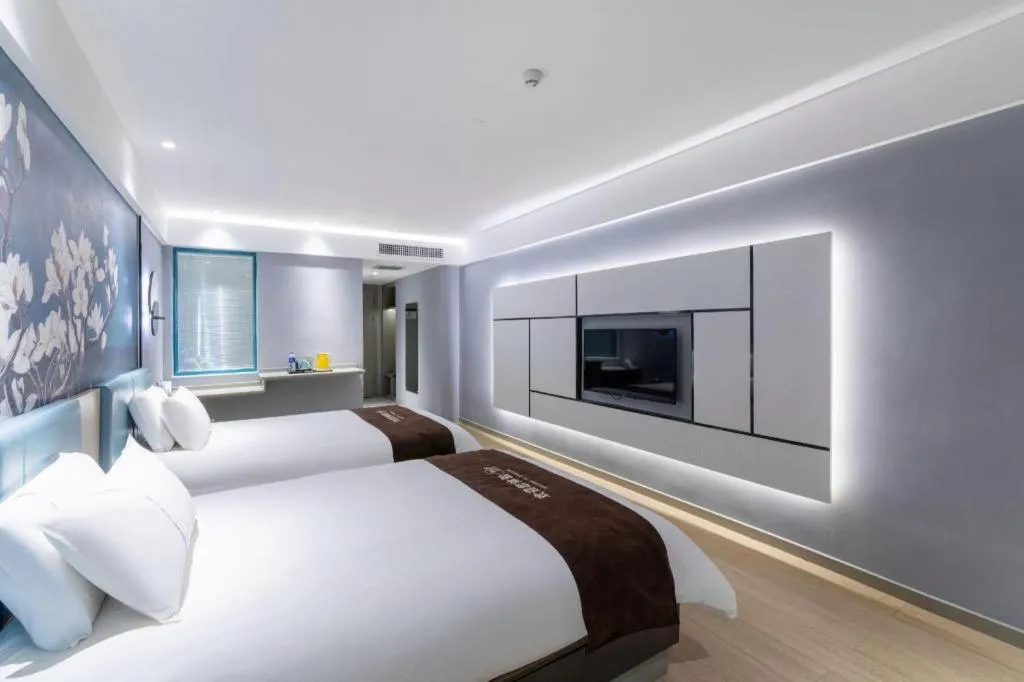 Bed in Magnotel Hotel Anshun West High-Speed Railway Station