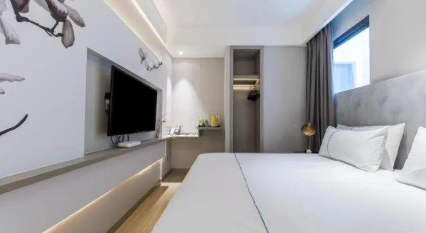 Bed in Magnotel Hotel Suzhou Guanqian Street Pingjiang Road