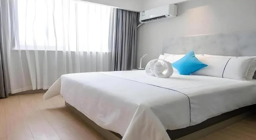 Bed in Magnotel Hotel Suzhou Guanqian Street Pingjiang Road