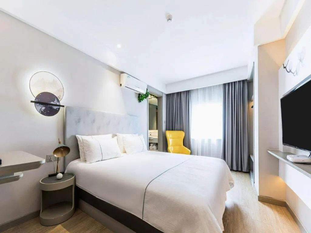 Bed in Magnotel Hotel Suzhou Guanqian Street Pingjiang Road