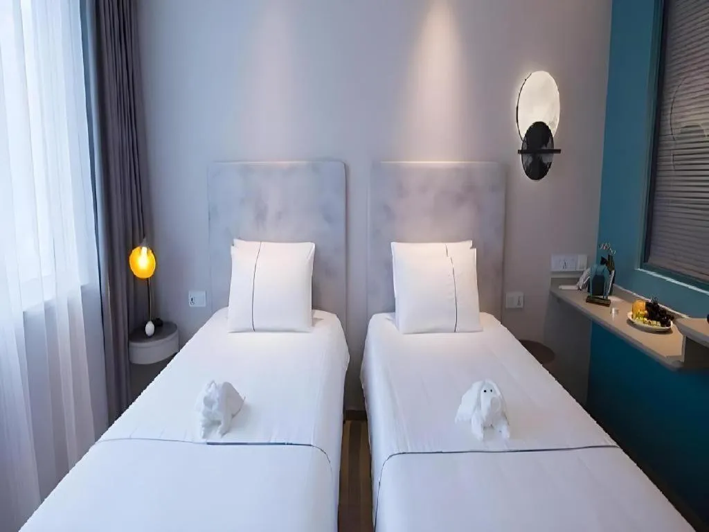 Bed in Magnotel Hotel Suzhou Guanqian Street Pingjiang Road