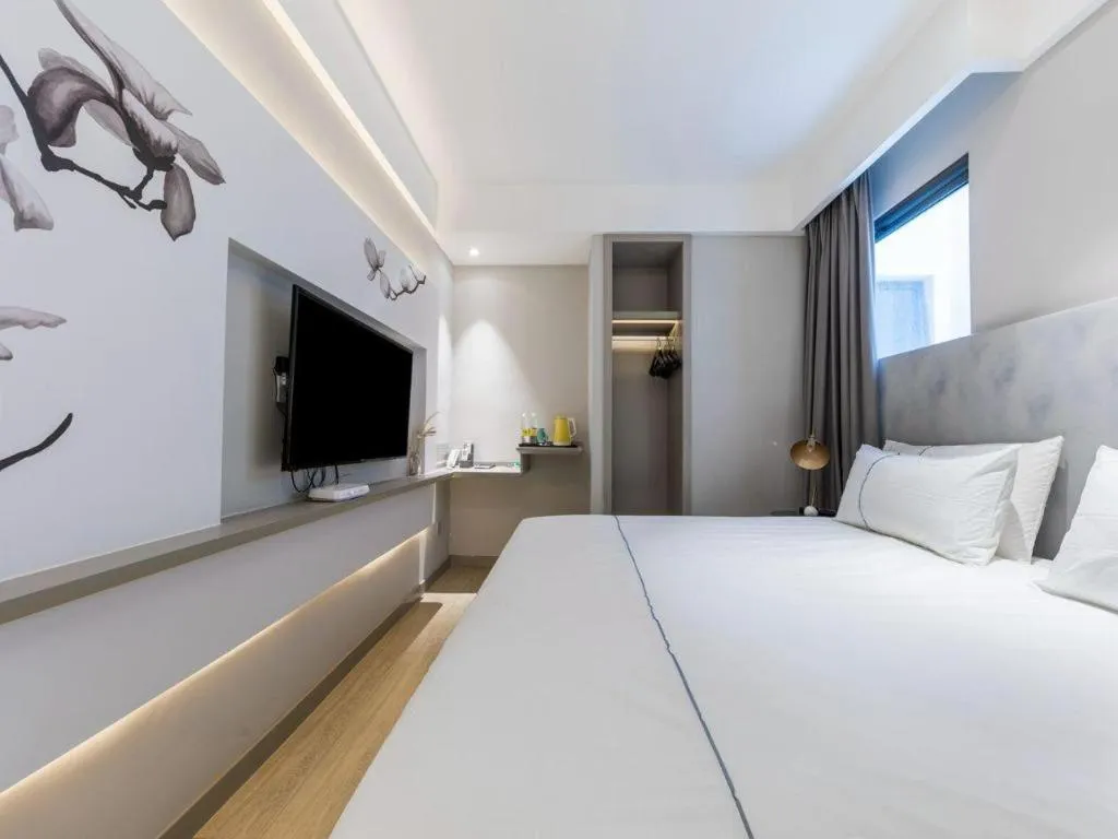 Bed in Magnotel Hotel Suzhou Guanqian Street Pingjiang Road