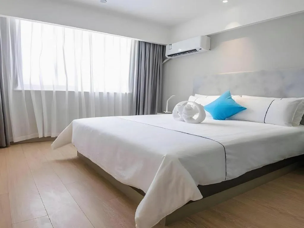 Bed in Magnotel Hotel Suzhou Guanqian Street Pingjiang Road