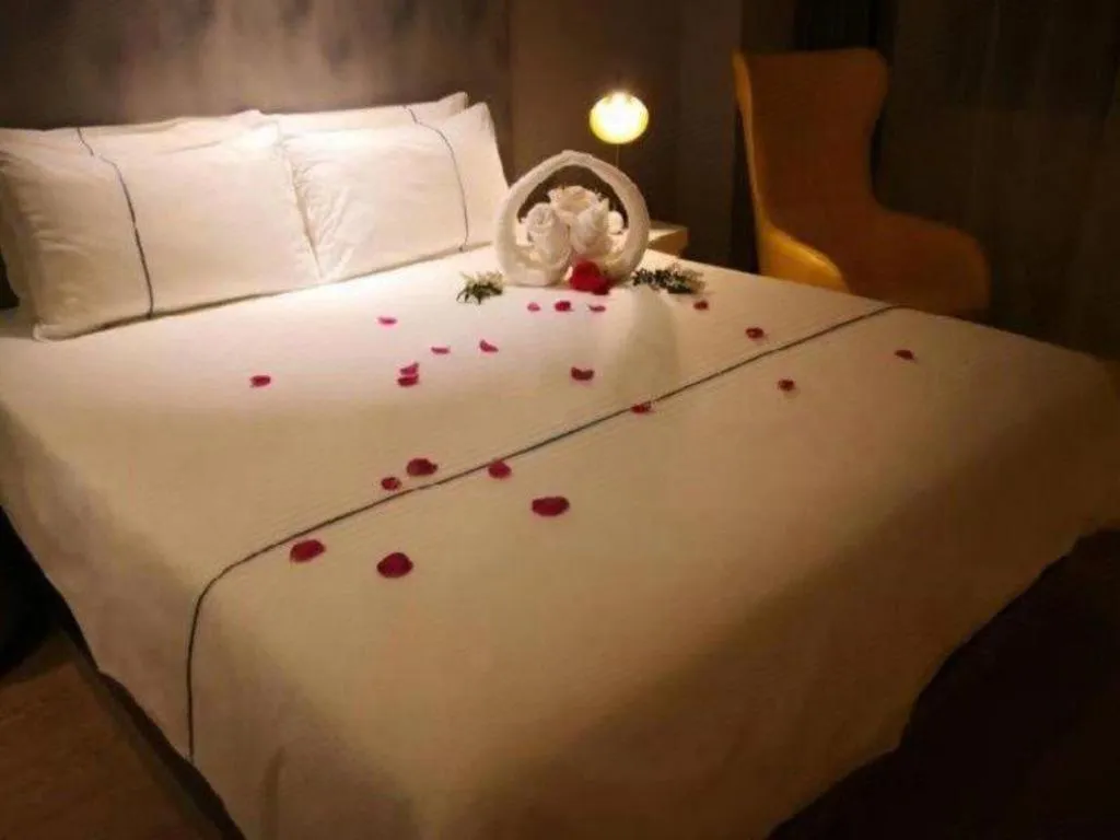 Bed in Magnotel Hotel Jining Yanzhou Metro Station Jiuxianqiao South Road