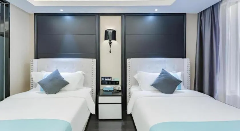 Bed in Xana Hotelle Zhengzhou North Passenger Terminal North University Town