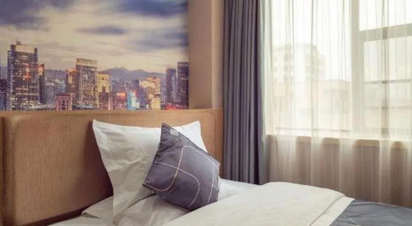 Bed in Chonpines Hotel Shenzhen Gongming Honghuashan Metro Station