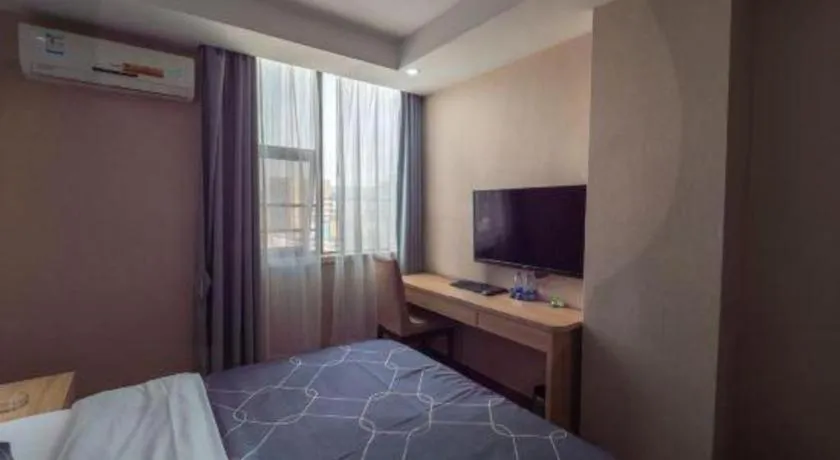 Bed in Chonpines Hotel Shenzhen Gongming Honghuashan Metro Station