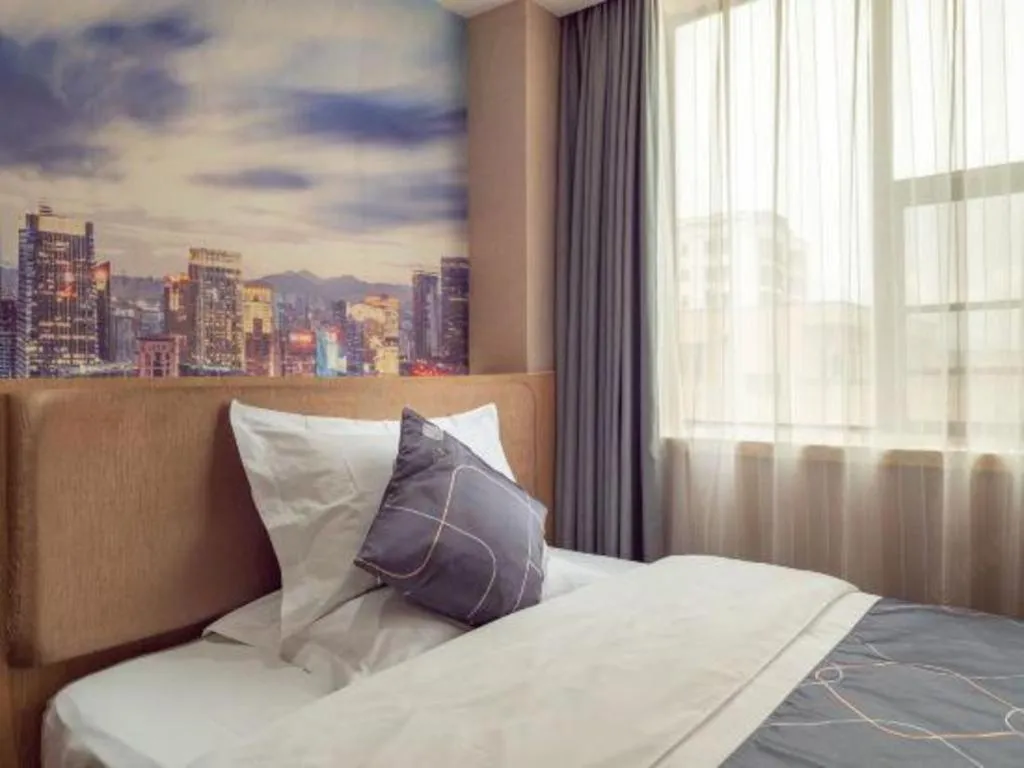 Bed in Chonpines Hotel Shenzhen Gongming Honghuashan Metro Station