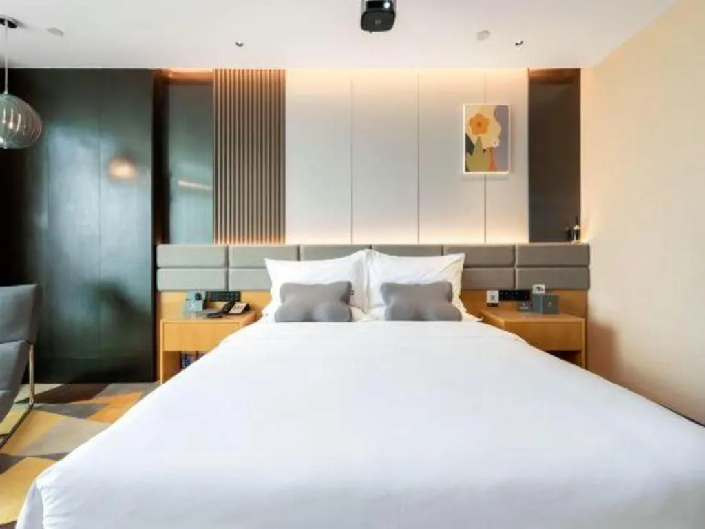 Bed in Chonpines Hotel Guangzhou Sunac Cultural and Tourism City Shiling